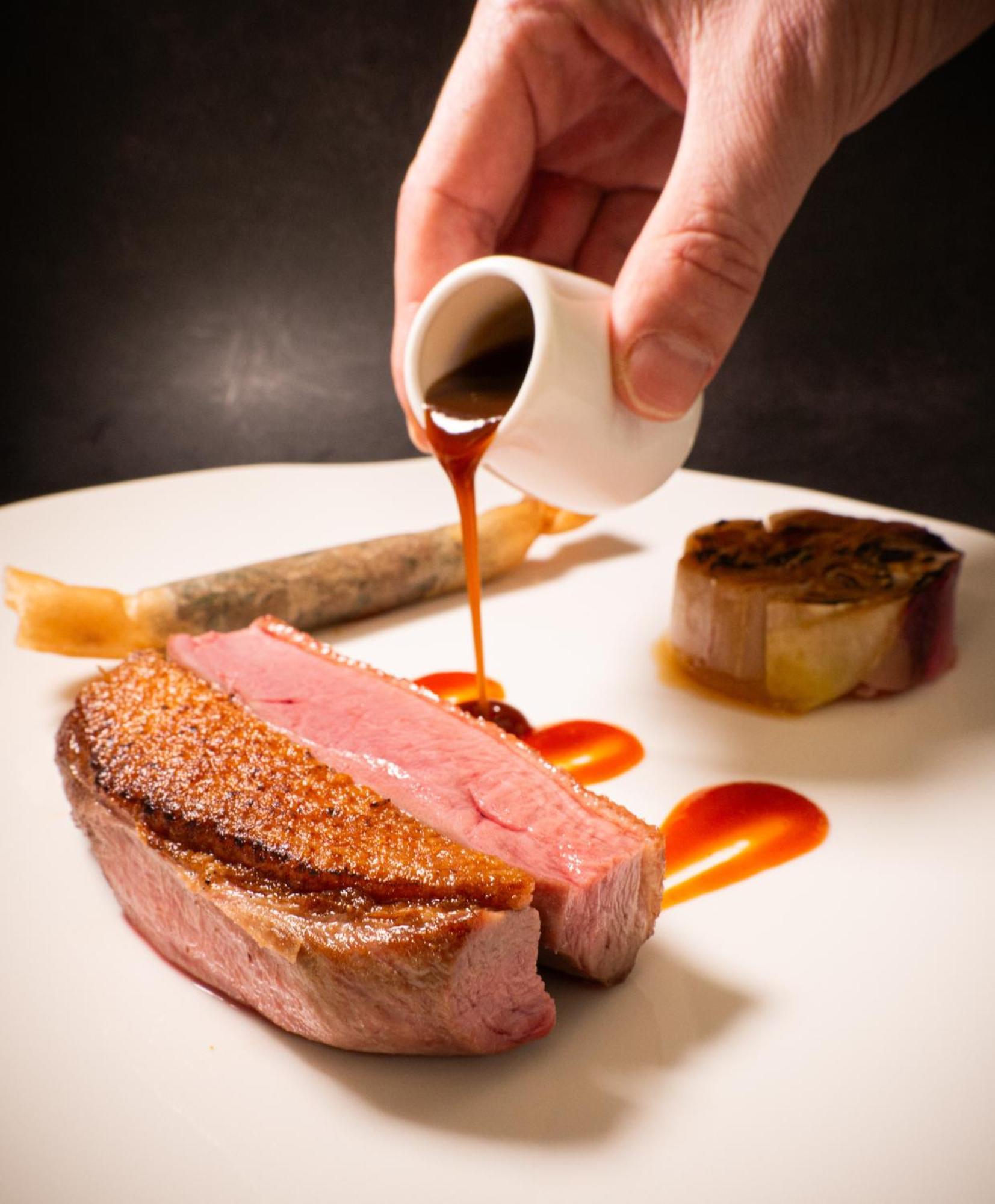 Le Mirador Resort & Spa Mont Pelerin Exterior photo A sauce being drizzled onto a steak